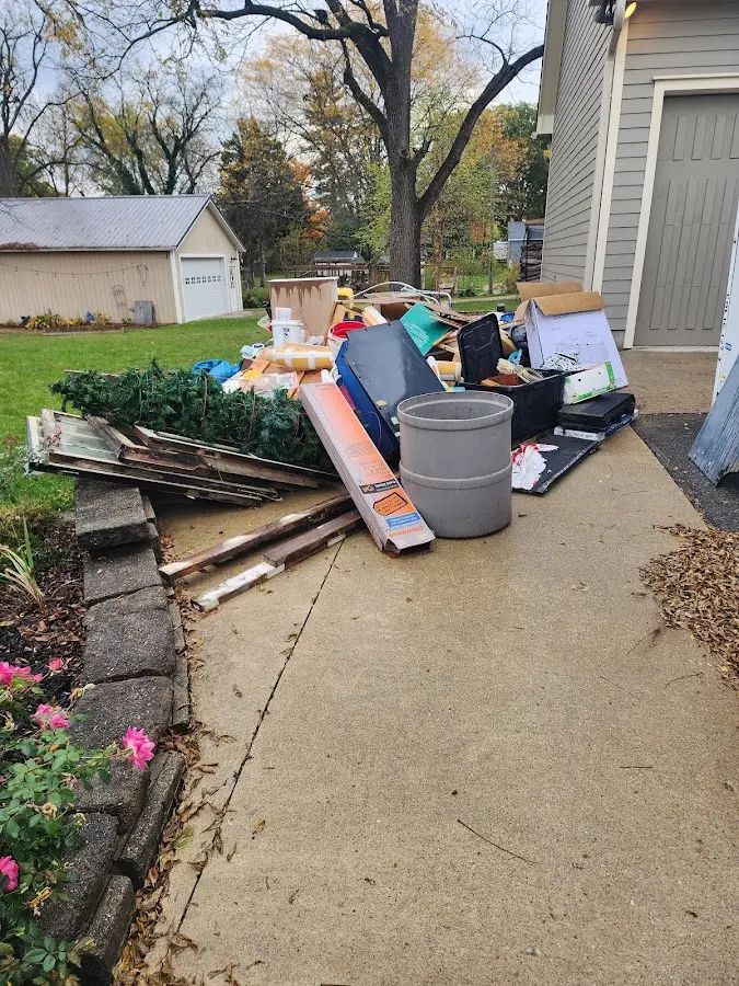 Dumpster being loaded with debris for 10 Yard Dumpster Rental in Hyattsville